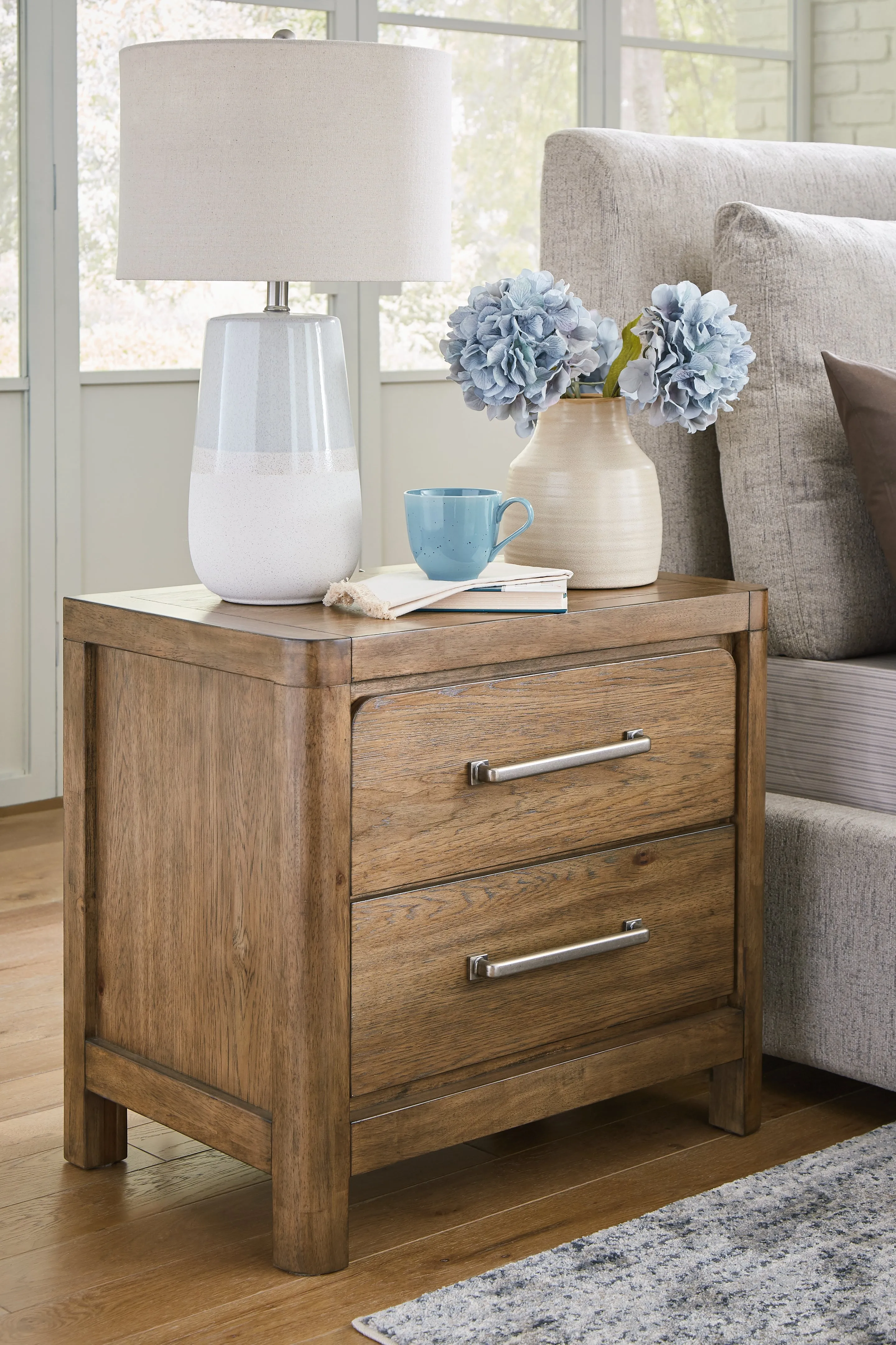 Cabalynn King Panel Bed with Storage with Mirrored Dresser, Chest and Nightstand in Light Brown